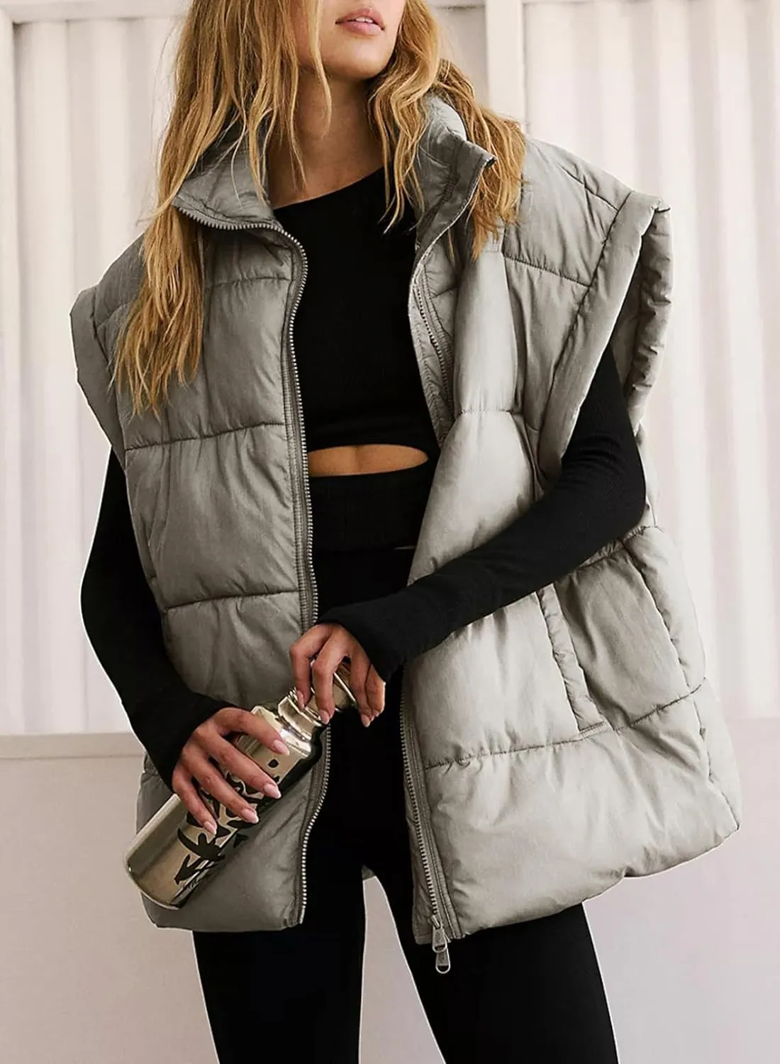 Dokotoo Women's Casual Winter Oversized Puffer Vest Stand Collar Flysleeve Insulated Padded Puffy Jackets Coat with Pockets